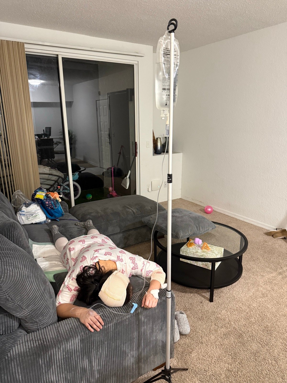 A client relaxing at home during an IV hydration visit